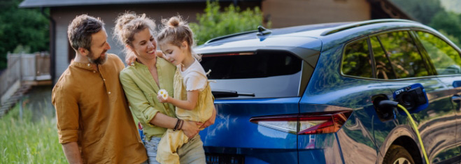 Image of family beside electric vehicle